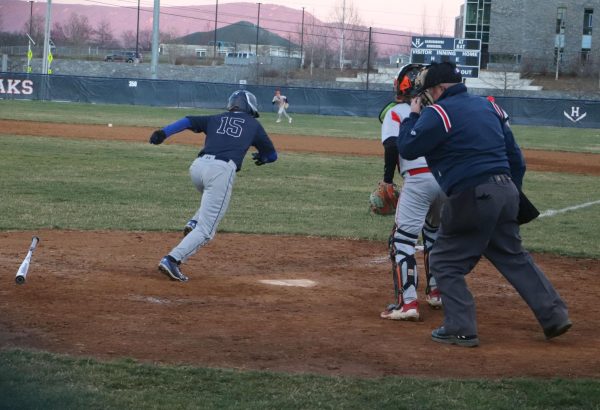 Sophomore Alexander Koubek sprints to first base after hitting the ball