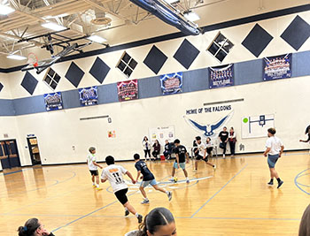 HHS student dribbles the ball to the goal