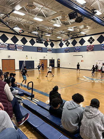 Players running toward the ball