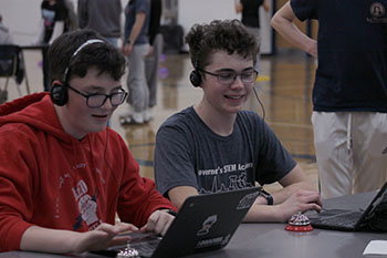 Sophomore's Shea Gibson and Samuel Walton are guessing what tune is playing at this station.