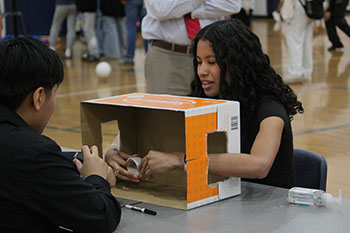 Sophomore Kaycee Tronco-Cordon is playing a game of guess what's in the box.