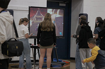 In this station students are playing Mario kart with drunk goggles on.