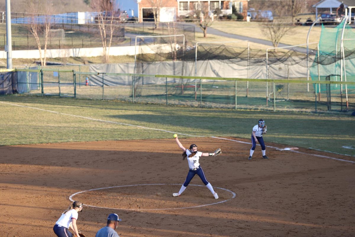 Freshman Delany Dayton pitching the ball.