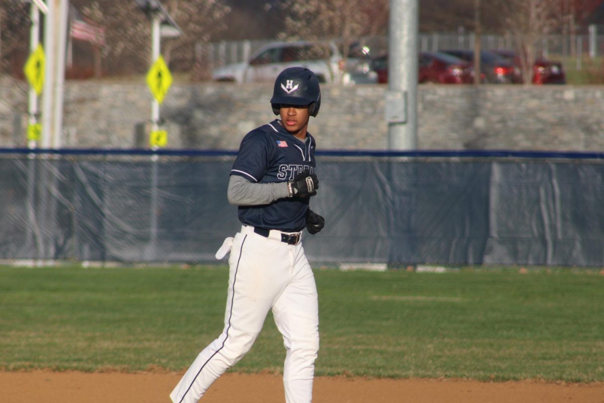 Senior Johan Feliz gets ready to run to third base 