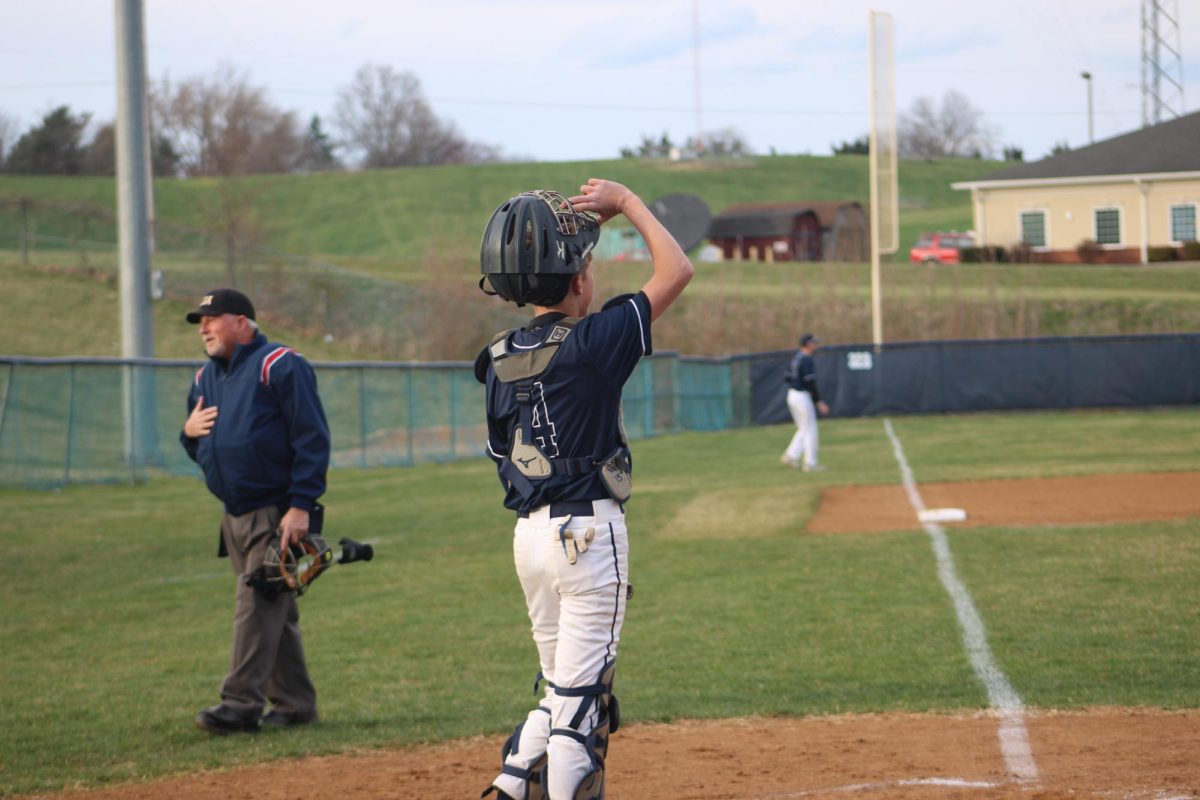 Freshman Josiah Gingerich encourages his teammates 