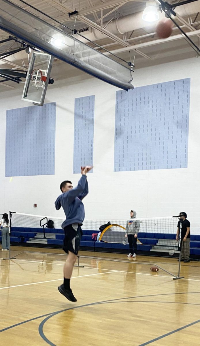 Freshman shoots the basketball.