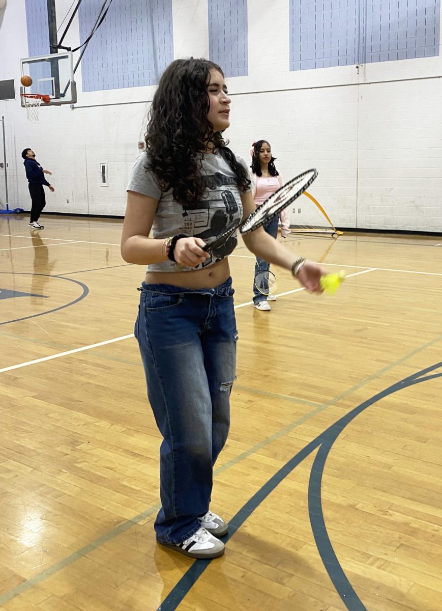 Freshman Yara Jalal gets ready to serve in badminton.