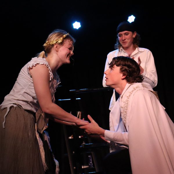 Louis Gibson as Louis De Rougemont, Madison Keller as Yamba, and in the background, Ell Norment as Ensemble.