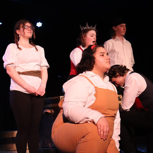 Hazel Pinnow as Queen, Louis Gibson as Louis De Rougemont, then Claire Keller, Leighan Baez, and Shea Gibson as guards.