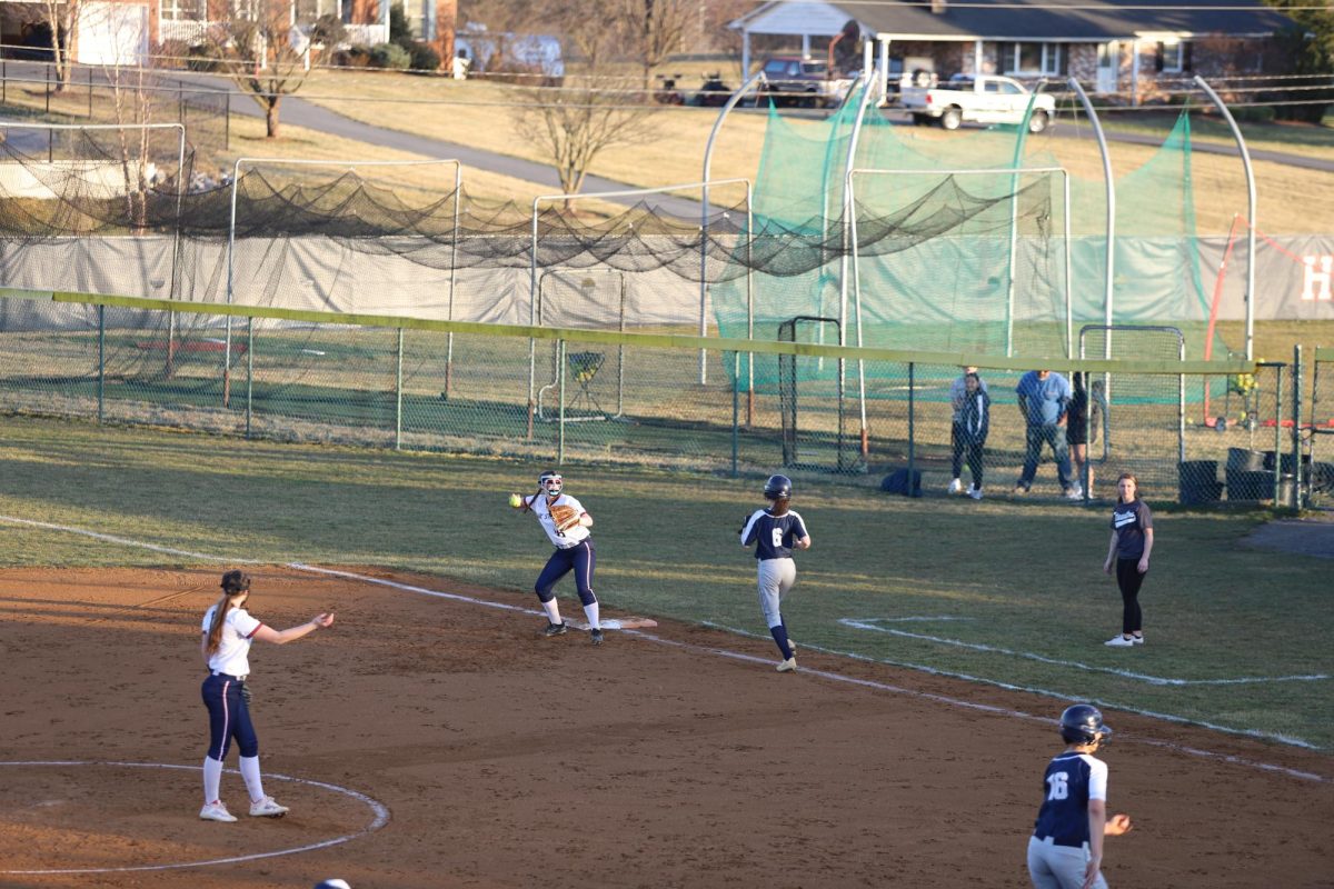 Junior LaMya Coleman-Will catching out at first base.