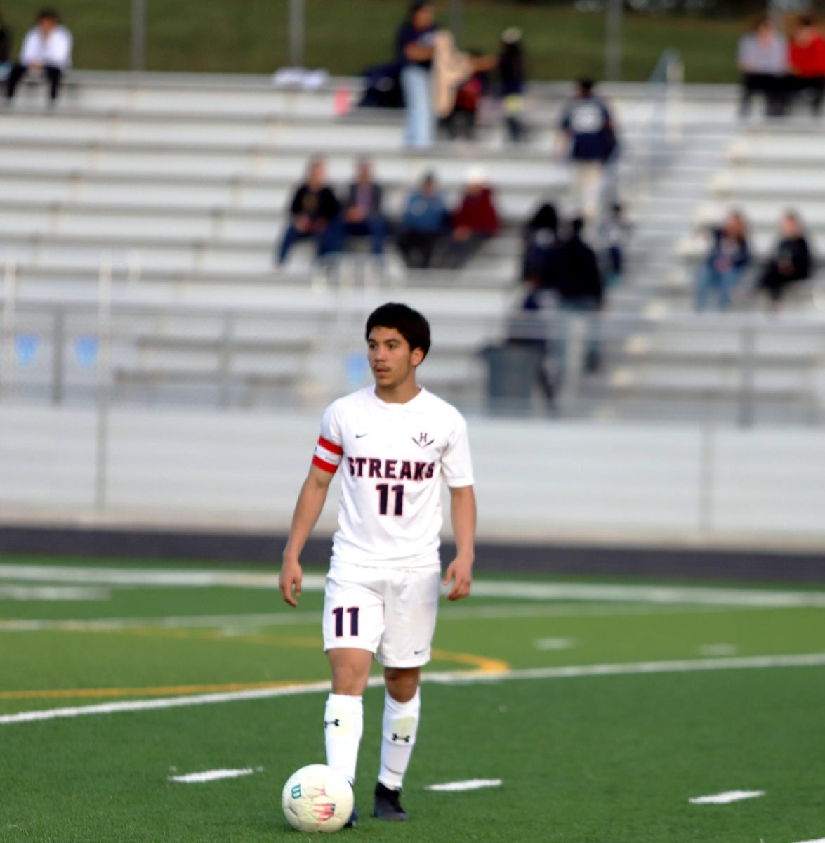 Senior Izaack Gonzales about to pass the ball 