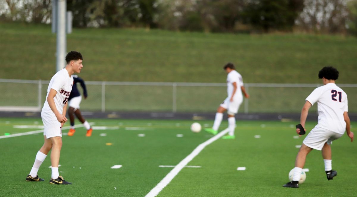 Senior Christ Galvez Hernandez and senior Juan Chirinos Zapata practicing passing the ball. 