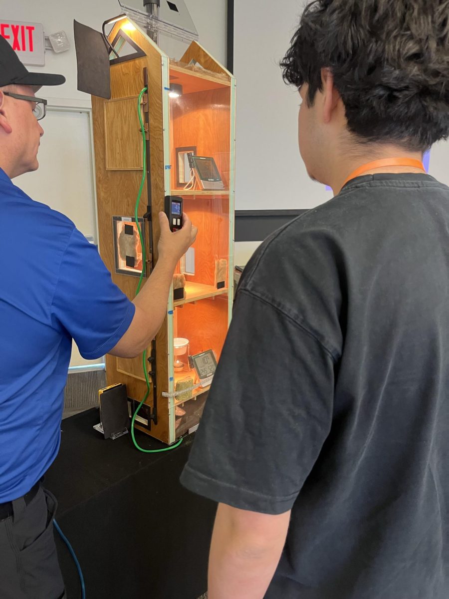 Teacher demonstrating installation to students