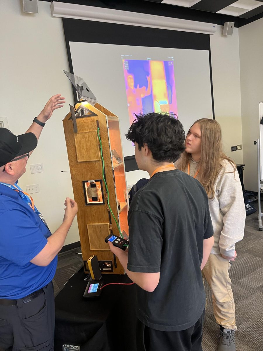 Teacher demonstrating installation to students