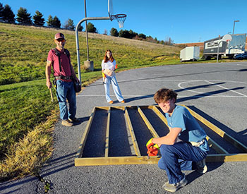 Jack Young and Liva Jwanmery nailing the left wall. Jack Young said, " This is harder than I thought."