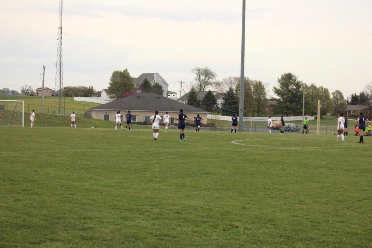 Waiting for the ball to be kicked back onto the field.