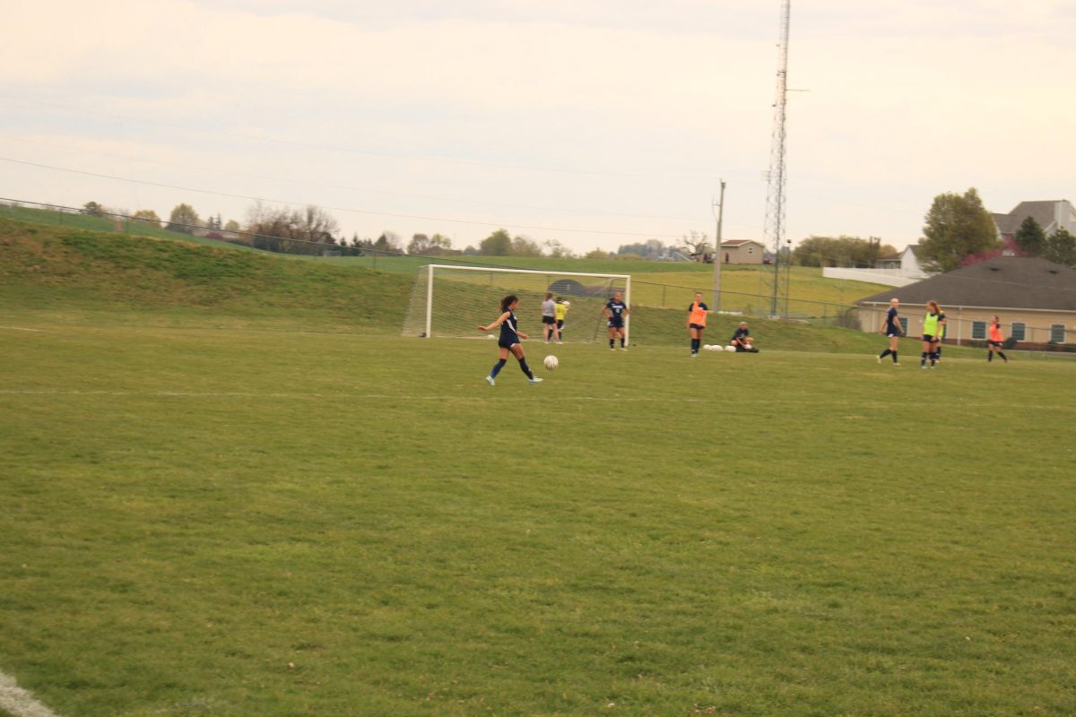 Emma rodriguez warming up with the soccer ball.