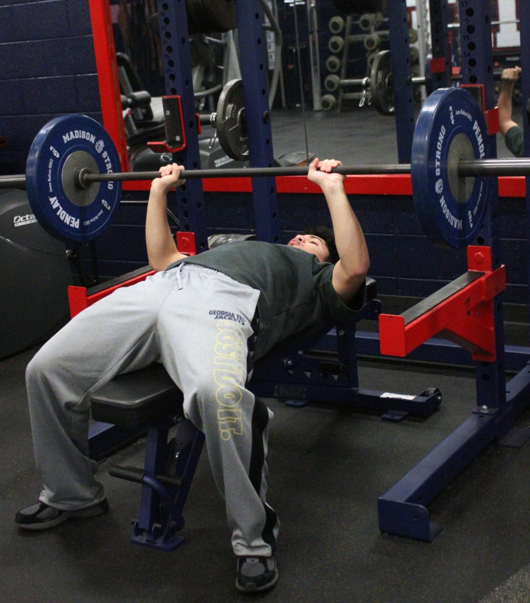 Fernando Rodriguez is benching a lot of weight. He mainly tries to work his arms in class because he already is in shape. He wants to build muscle to better improve himself.
