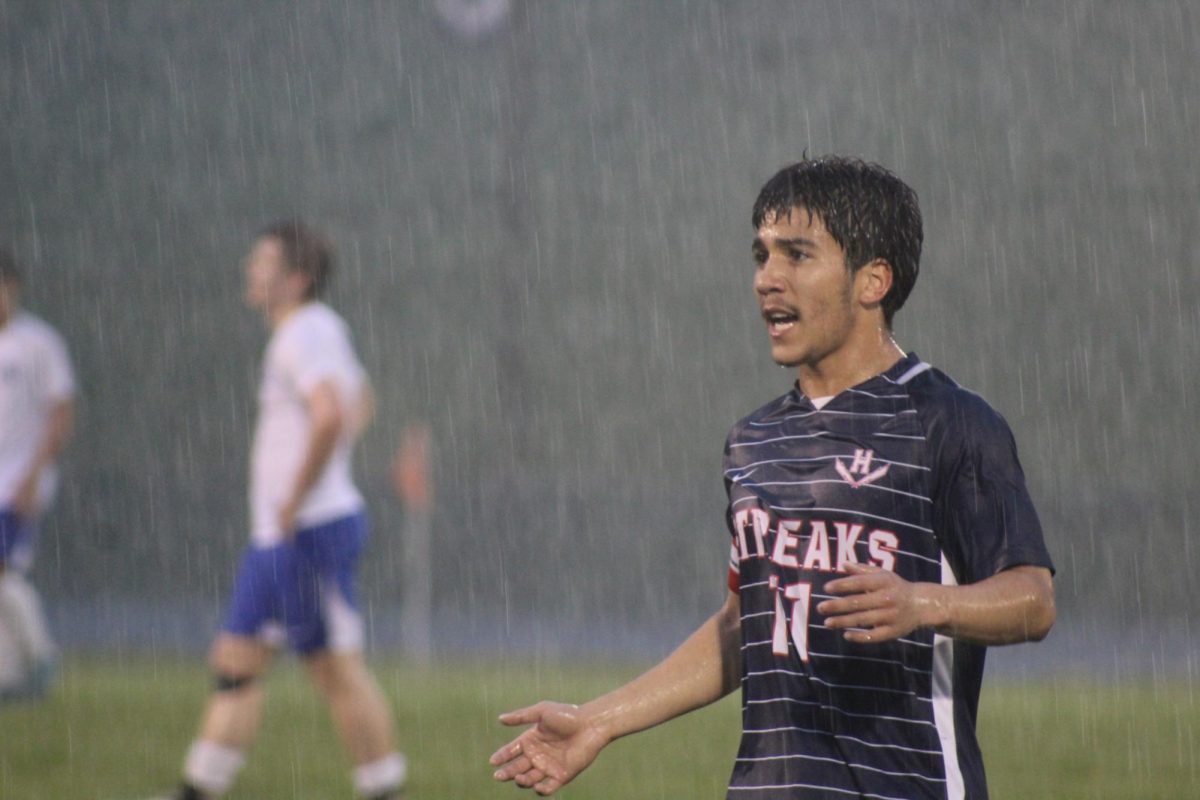 Senior Izaack Cruz communicates with his teammates on the field.
