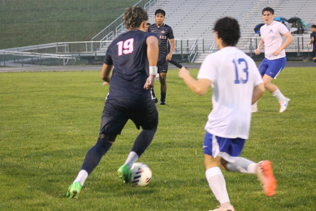 Senior Rayyan Garout is seen passing the ball. 