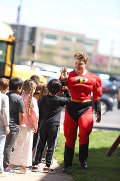 dresses up as mr incredible and waves bye to kids 