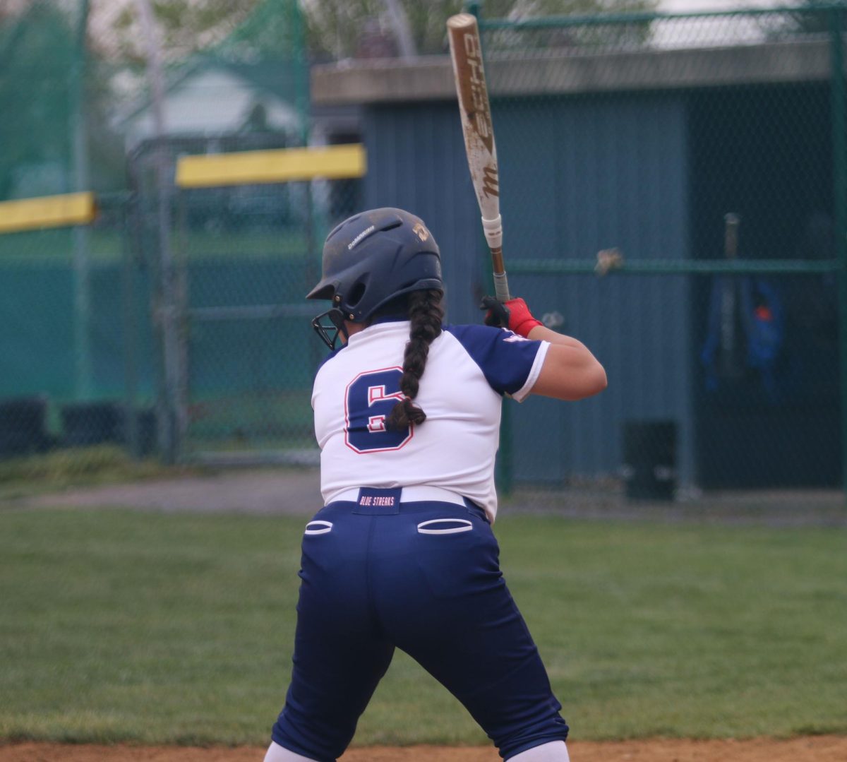 Eighth grader prepares to hit the ball