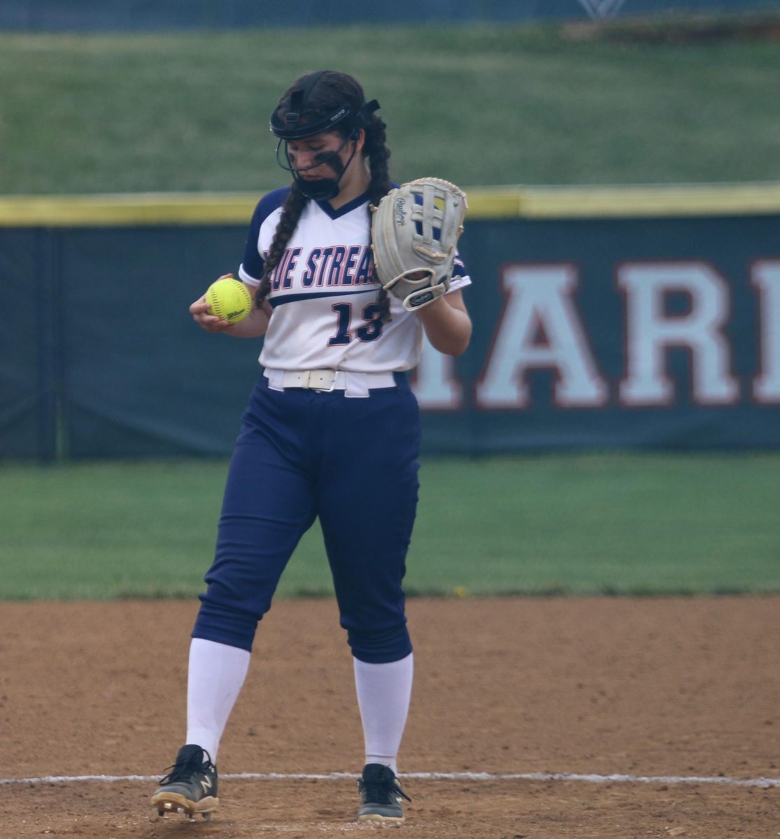 Eighth grader Talia Robles prepares to pitch