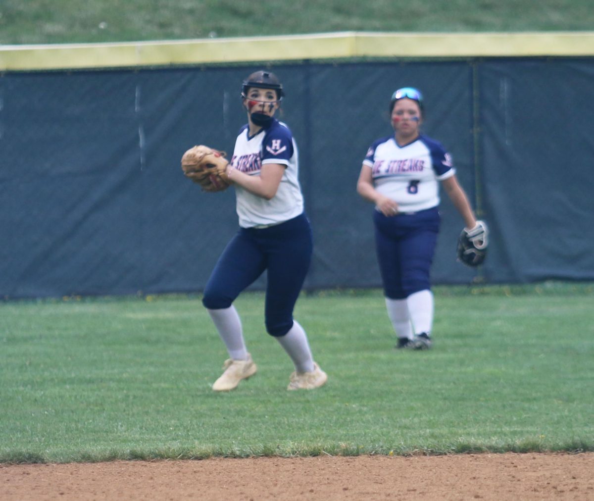 Freshman Rylie Patterson throws the ball back to home