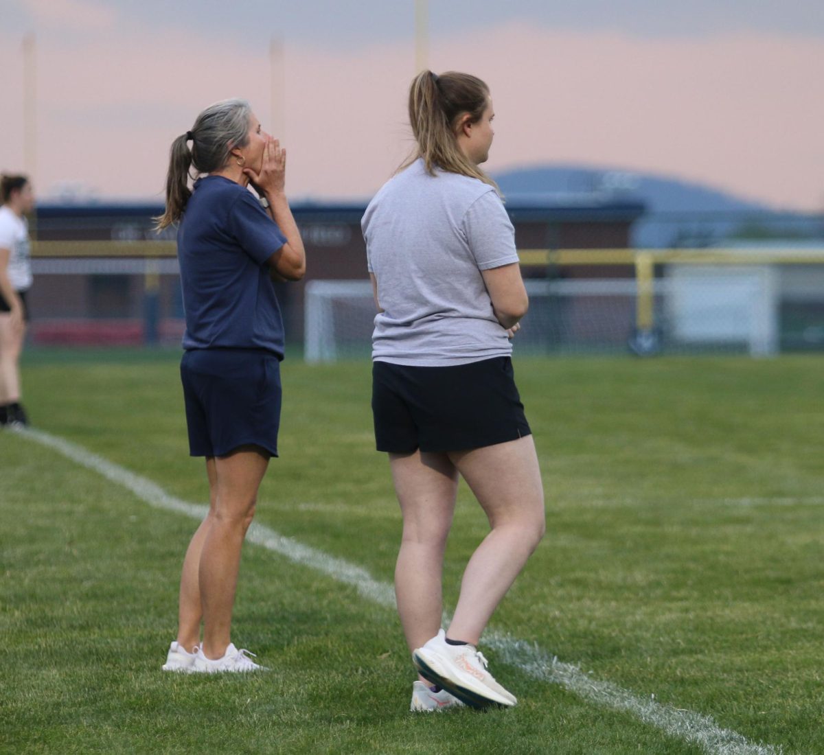 Varsity coach Amy Walters cheers on her players