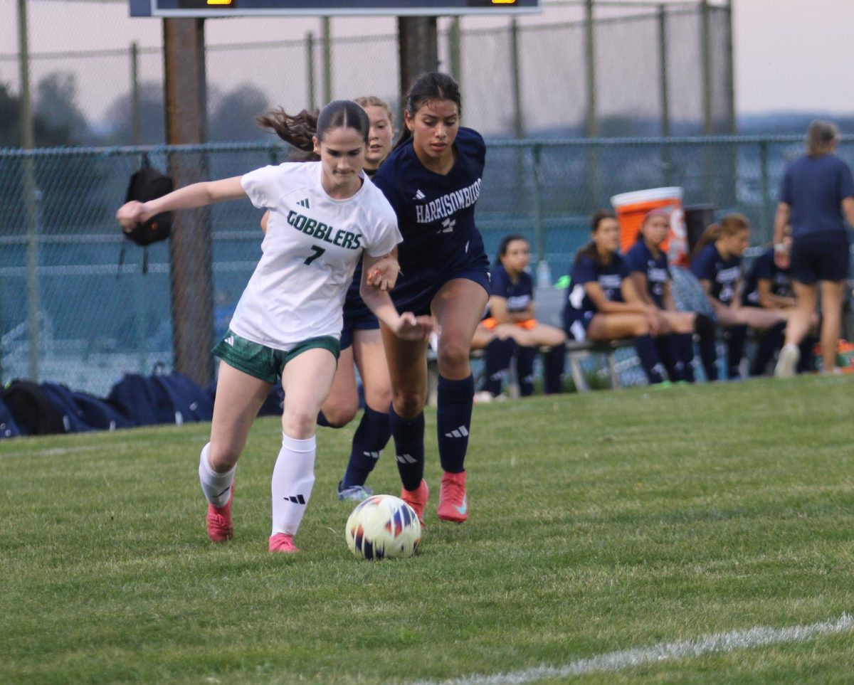 Senior Leeanne Lara Irias fights with a Broadway player for the ball