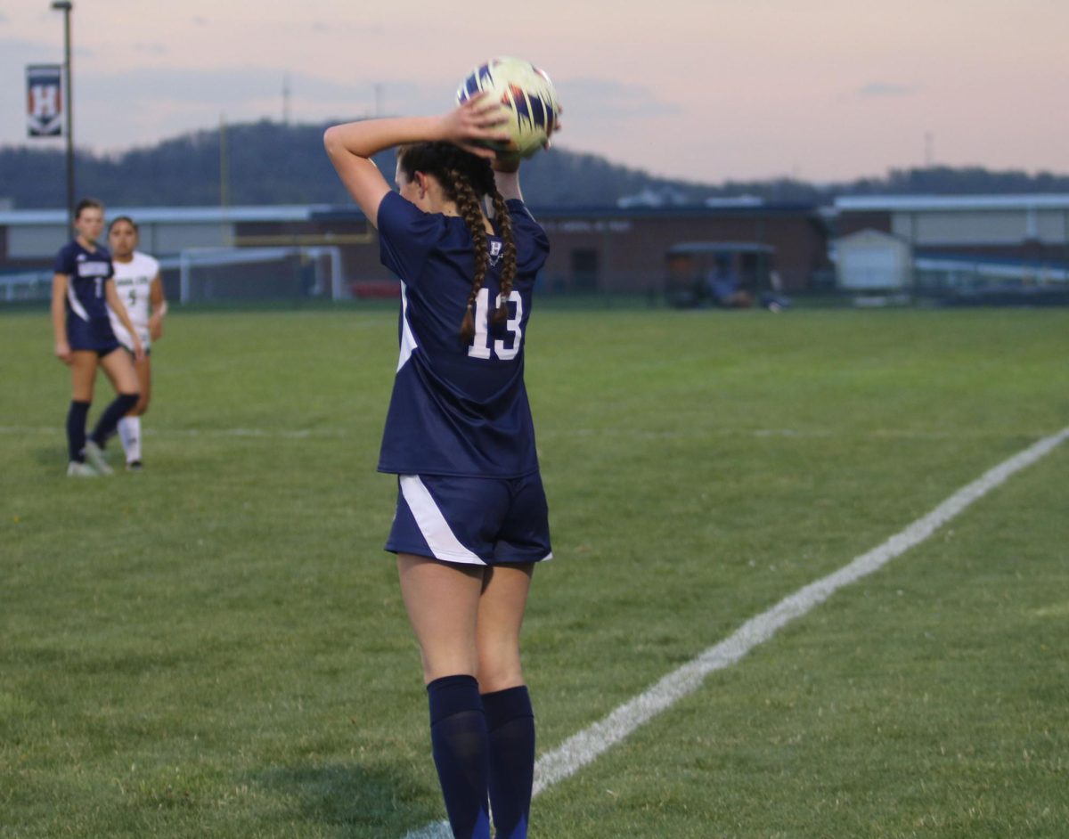 Freshman Rayna Hostetler throws the ball in