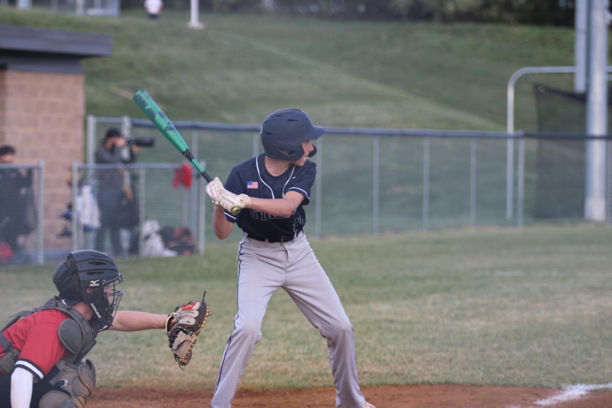 freshman Abram Wenger waiting to bat 