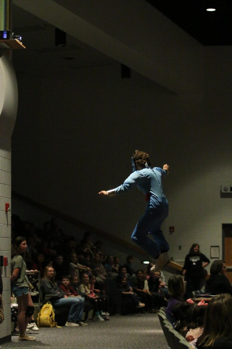 Senior Davis Bert playing as the genie from Aladdin. "It's a very fun and cool experience, I love the children's reactions".