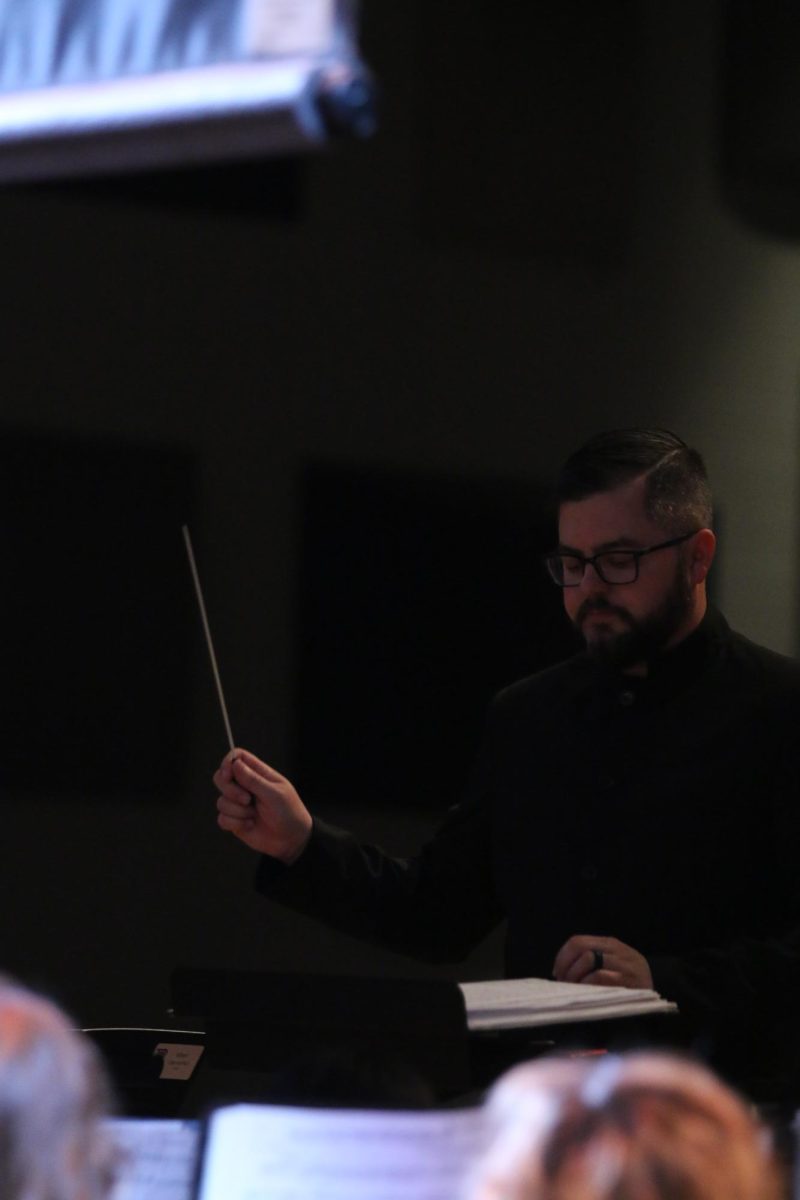 Daniel Upton conducting Symphonic band for tiny tots. "I thought it went great, there was a lot of energy from the students performing and the students audience members".