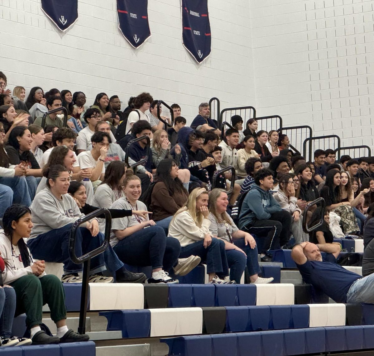 Senior class and some teachers watching the games during pep rally.