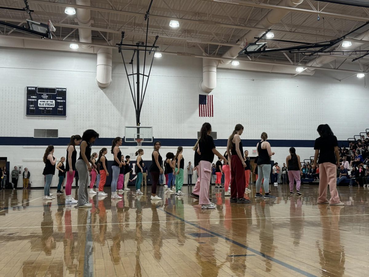 Dance team performing a routine during the spring pep rally.