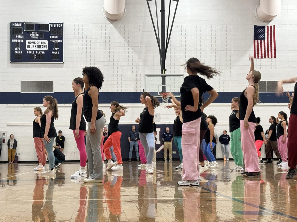 Dance team performing a routine during the spring pep rally.