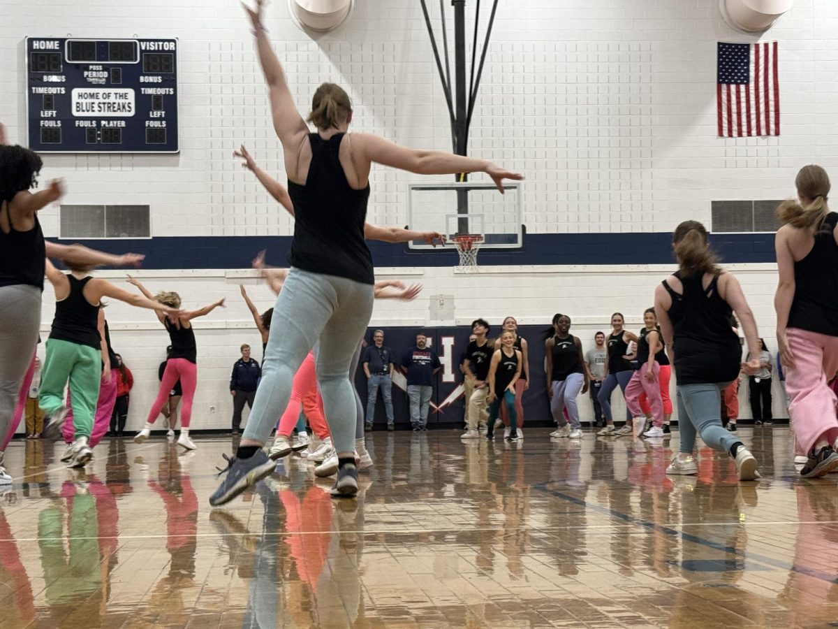 Dance team performing a routine during the spring pep rally.