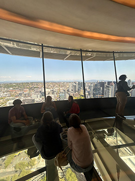 Kyleigh Morris sits on space nettle glass floor and enjoys views with freinds."the space neetle was scary" says Morris
