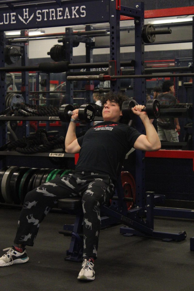 Isa Hernandez Carrera exercising to gain more muscle for wrestling. "Training for wrestling pushes me to my limits, but it’s the only way to get stronger on the mat."