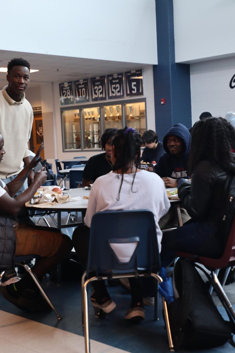 Students sitting down at lunch.