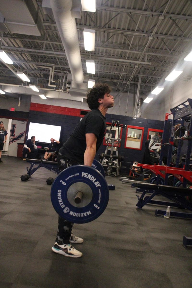 Isa Hernandez Carrera weight lifting in weightlifting class. "I never thought I’d love lifting weights this much, but here I am."