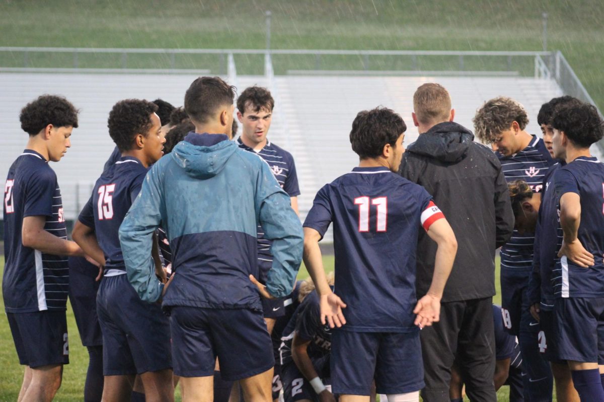 Coach gives a speech to the team before the game begins.