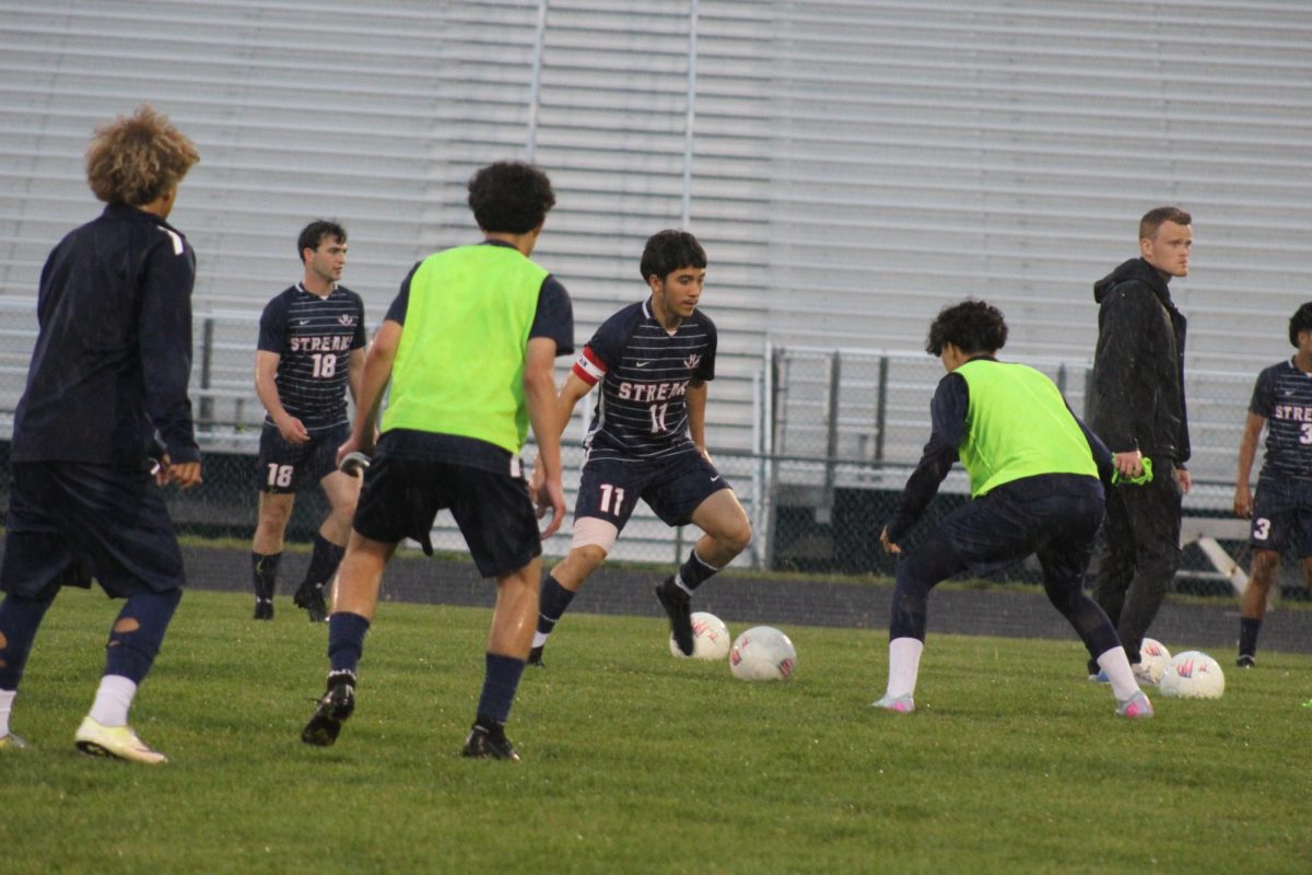 Varsity team warms up before the game.