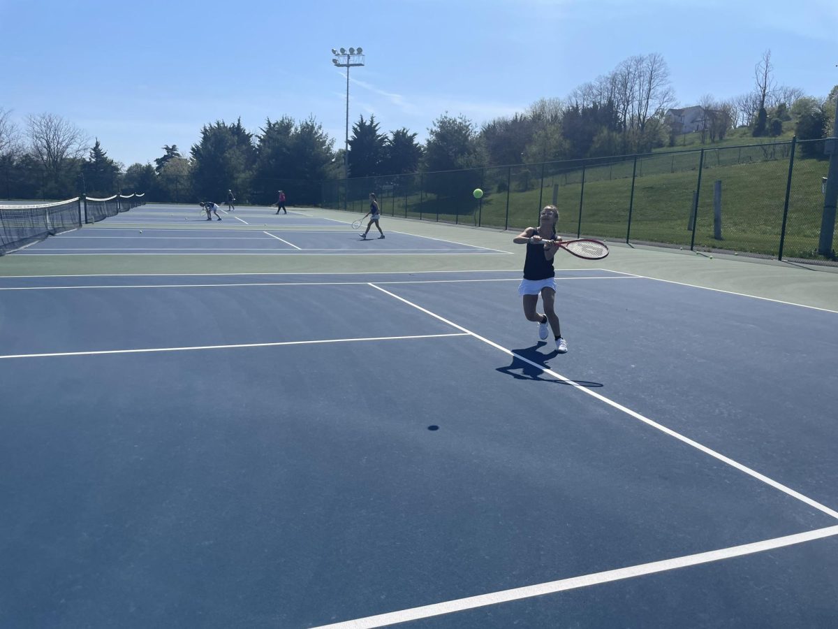 Freshman Ava Thompson hits the ball with her backhand. 
