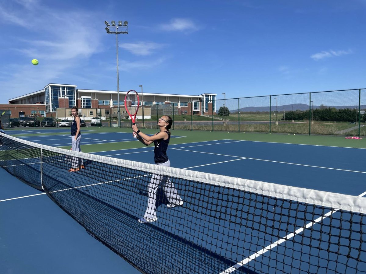 Freshman Ava Thompson practices volleying. 
