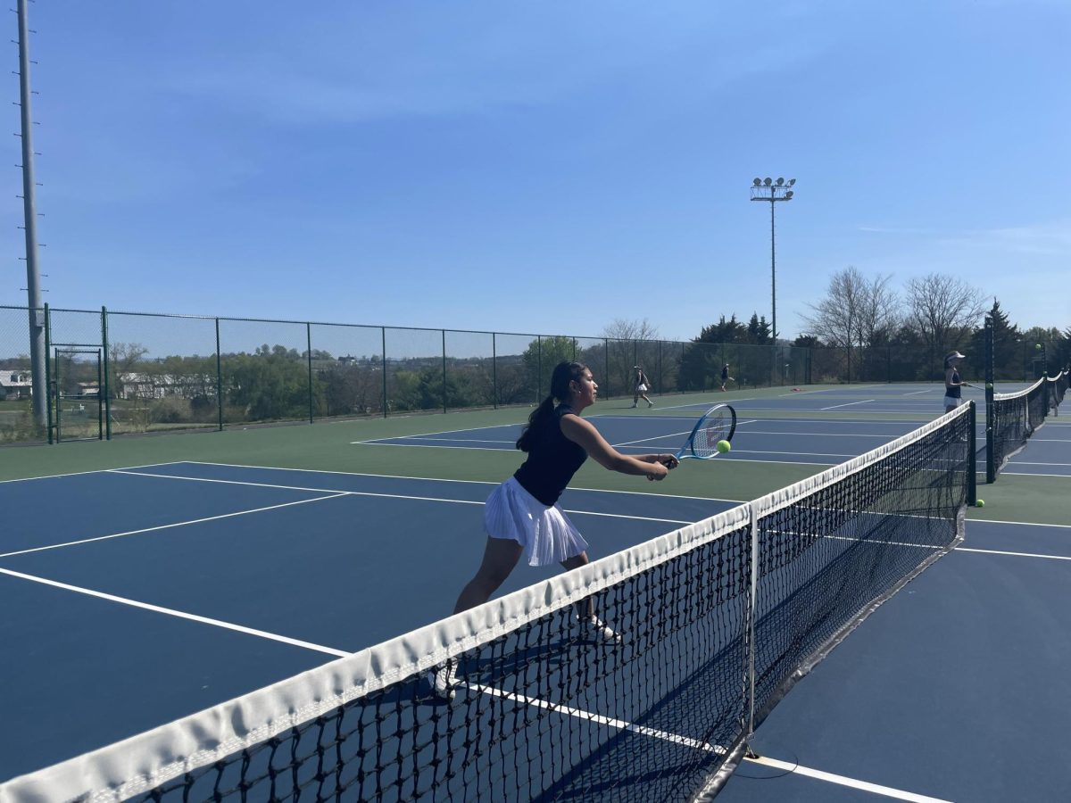 Freshman Brianna Aceituno practices her volleys. 