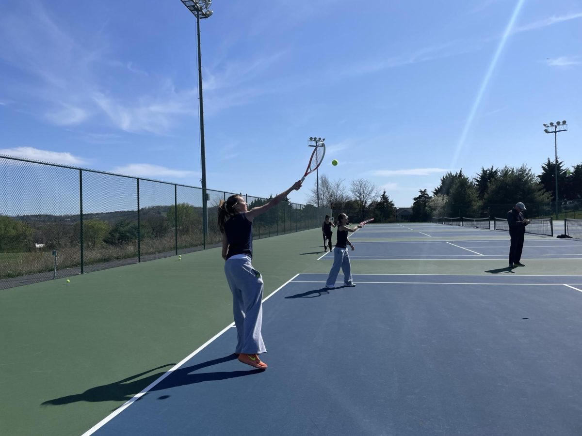 Sophomore Brynn Smith practices her forehand swings. 