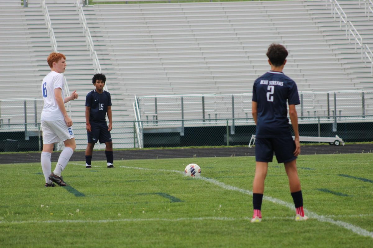 Eighth Grader Joel Metzler and Freshman Kevin Velasquez prepare for the opponent to shoot the ball. 