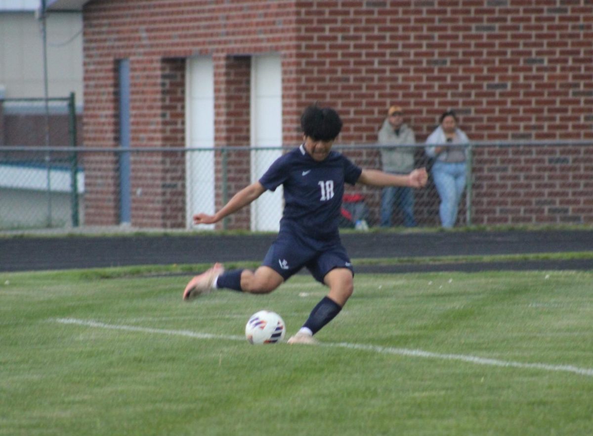 Sophomore Josue Sontay kicks the ball.